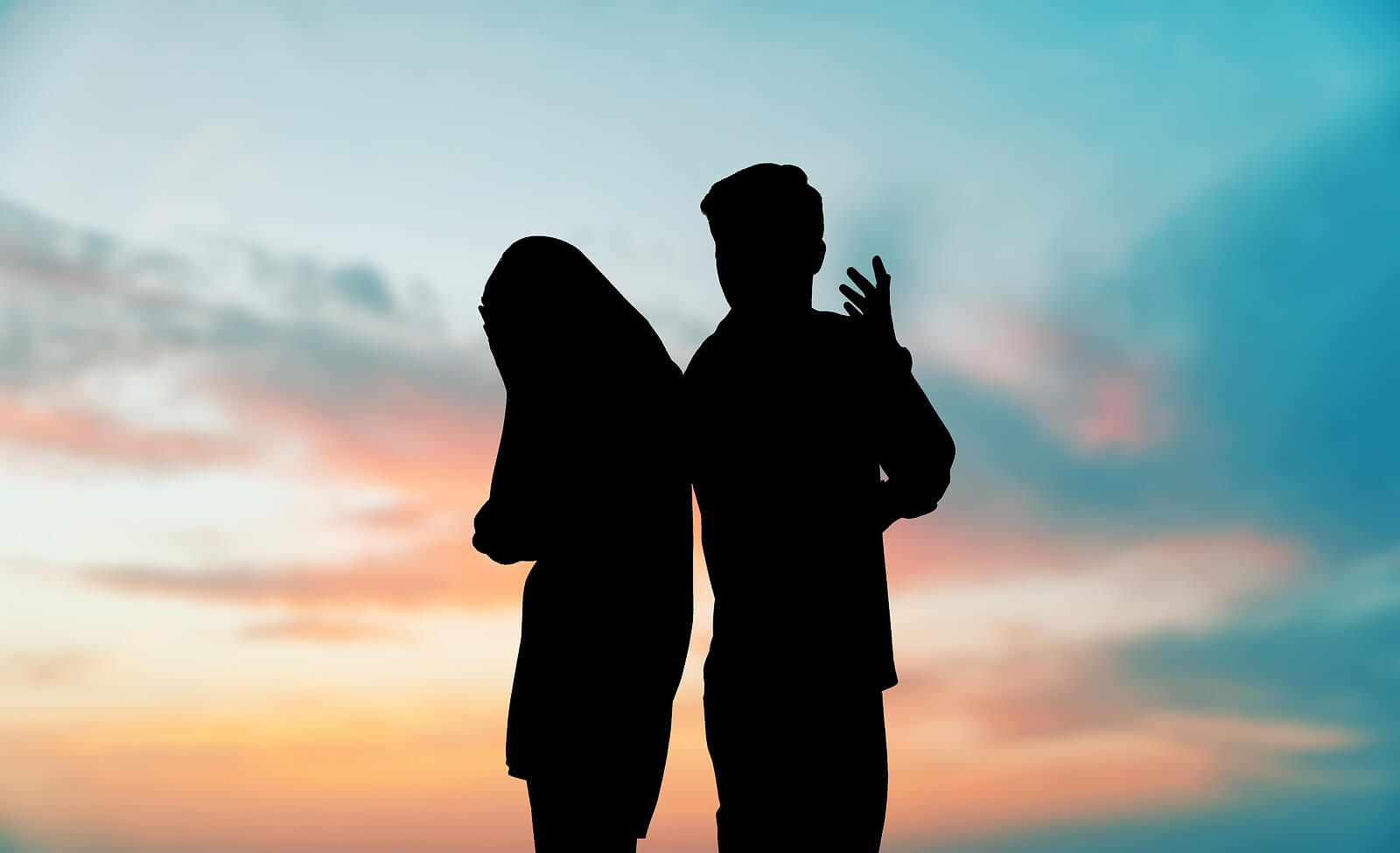 Two silhouettes of a man and a woman arguing. Trying to overcome your relational trauma in Austin, TX? Our trauma therapist can help you today!