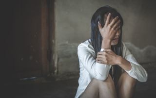 A woman sits on the floor crying. Dealing with developmental trauma but do not know what to do about it? Speak with a trauma therapist in Austin, TX to see if trauma therapy is right for you.
