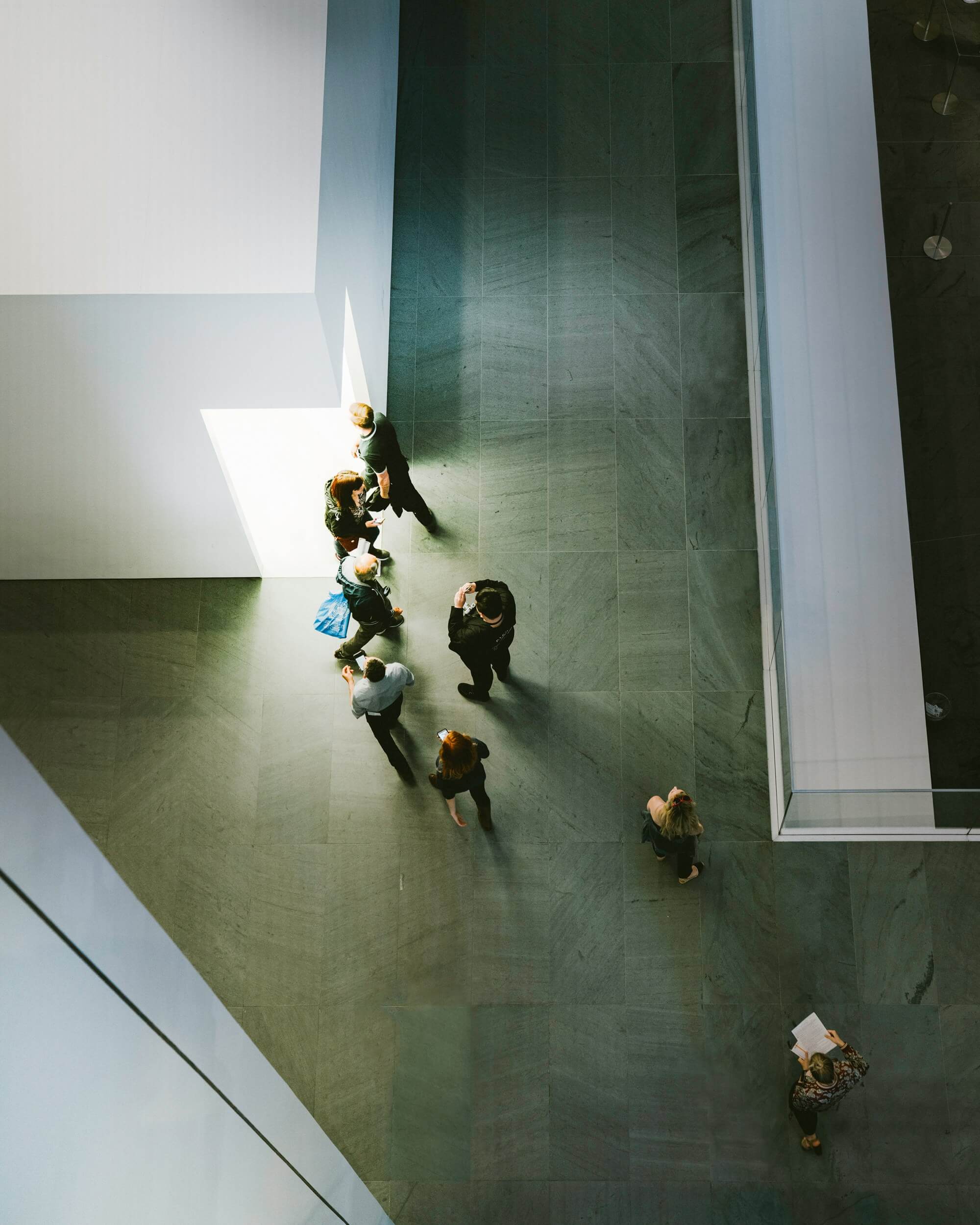 Above image of people walking through a museum. Discover how effective online therapy for introverts in Houston, TX can help you accept your unique traits.